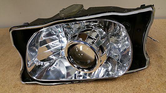 Projector mounted to light assembly